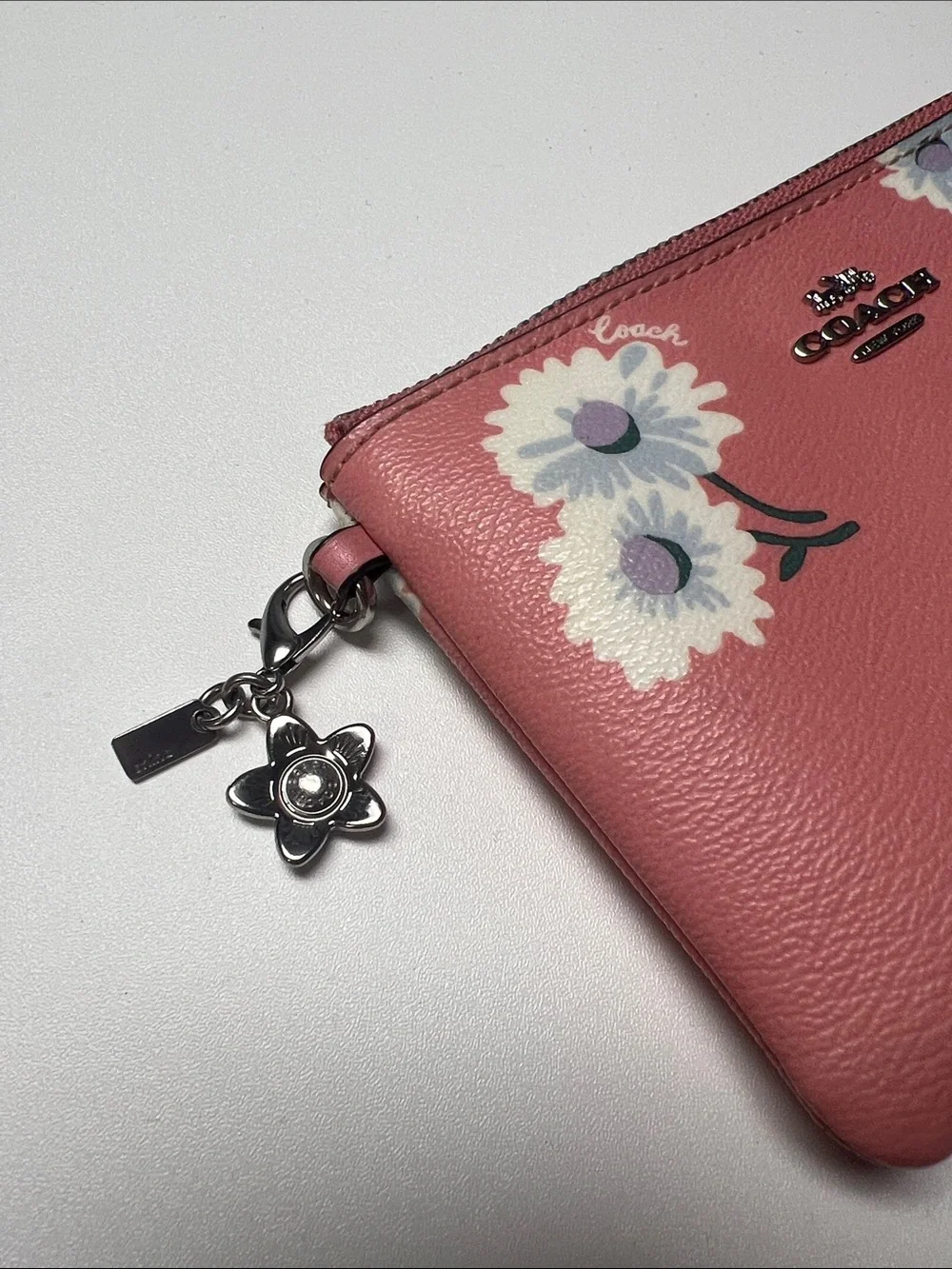 Coach Coral Pink Floral Wristlet with Silver Charm